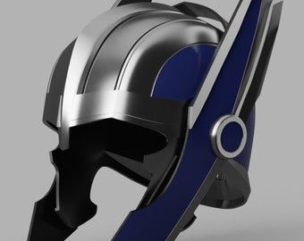 May include: A silver and blue helmet with a wing design on the side. The helmet has a dark gray face mask and a circular detail on the side.