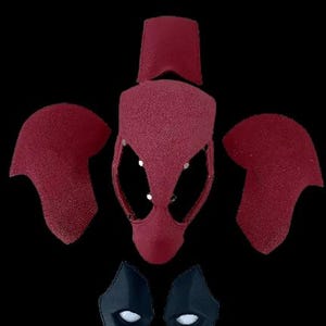 May include: A red and black Deadpool mask costume set. The set includes a full head mask, two shoulder pads, and two eye pieces.