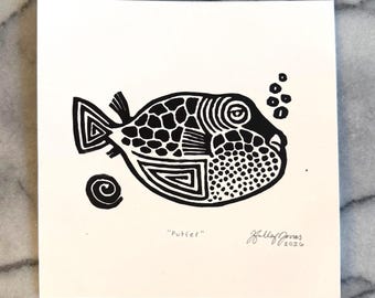 Grabado en linóleo original de Puffer sobre papel, 7 x 7 pulgadas, sin marco.