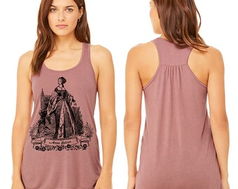 May include: A mauve tank top with a black and white illustration of Anne Boleyn, a historical figure, on the front. The text "Anne Boleyn" is printed below the illustration.