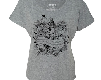 May include: A gray, short-sleeve t-shirt featuring a black and white illustration of Alice in Wonderland with a quote: "Why, sometimes I've believed as many as six impossible things before breakfast."