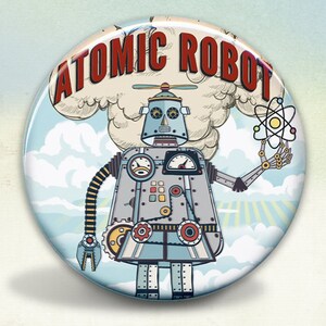 May include: A round button with a cartoon illustration of a robot holding an atom. The robot is silver and blue with red, yellow, and black details. The text "ATOMIC ROBOT" is in red letters on a white cloud.