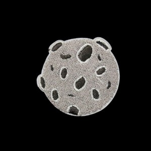 May include: A grey and white embroidered patch of a moon with black craters.