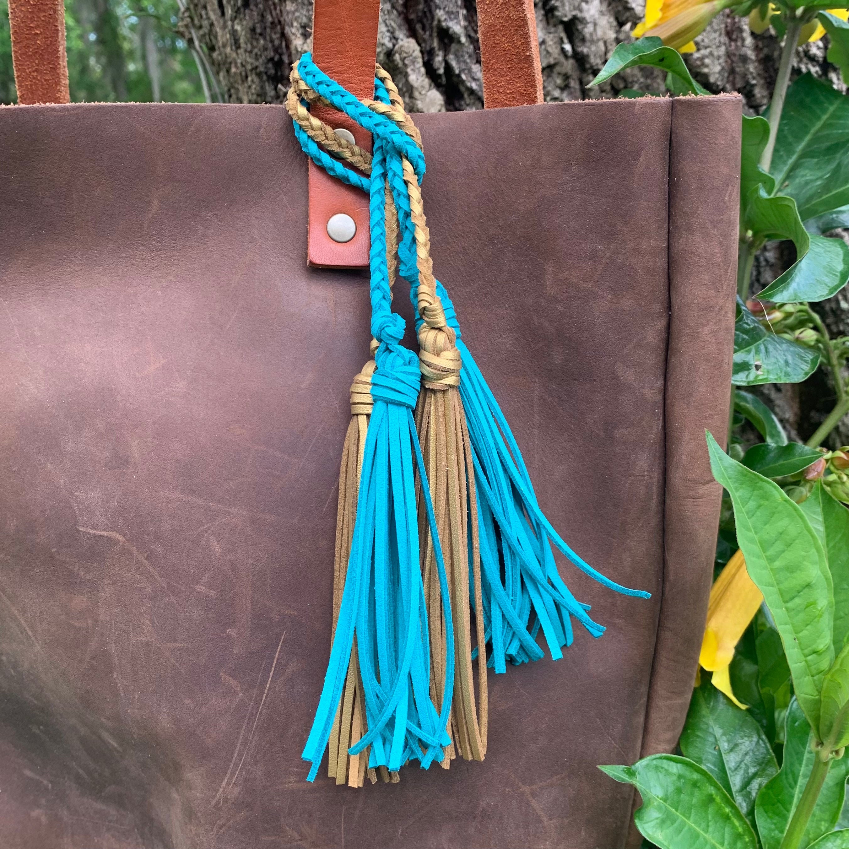 Leather tassel bag best sale charm