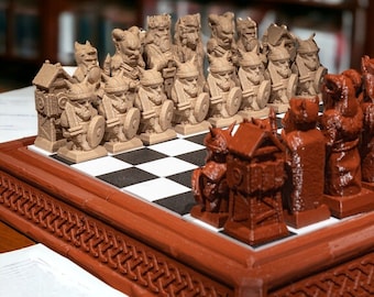 May include: A detailed chess set with intricately designed pieces. The chess pieces are in two colors, tan and brown, and are set on a black and white checkered board. The board is framed in brown with a decorative border. The background is blurred.