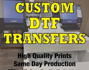 May include: A close-up of a digital printing machine with the text "CUSTOM DTF TRANSFERS" in yellow letters. The text below reads "High Quality Prints Same Day Production for Bulk Printing".