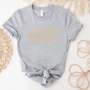 a t - shirt with the words stop wars on it
