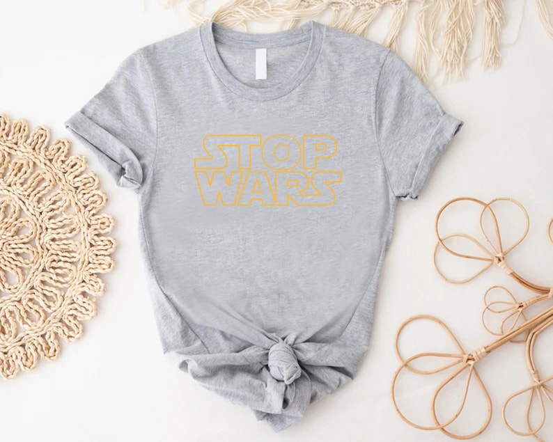 a t - shirt with the words stop wars on it