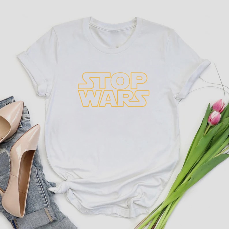 a t - shirt with the words stop wars on it