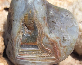 A stunning Lake Superior water level agate with killer banding and a bit of exposed mosaic