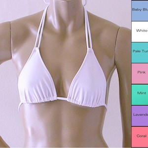 May include: White triangle bikini top with adjustable straps. The top is made of a smooth, stretchy fabric.