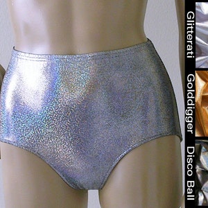 May include: High-waisted silver shorts with a shimmering, glittery finish. The shorts have a smooth, seamless design and a high-cut leg opening. The image also shows fabric swatches labeled Glitterati, Golddigger, and Disco Ball.