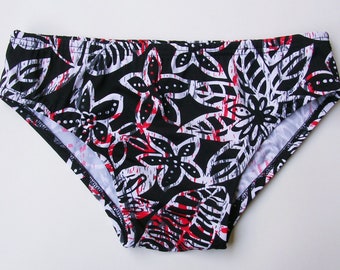 Mens Low Rise Swim Brief Swimsuit in Black, White, and Red Batik Floral Print