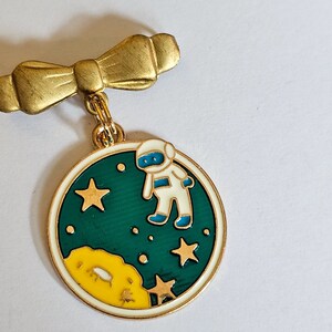 Astronaut enamel brooch on vintage brass bow pin image 1