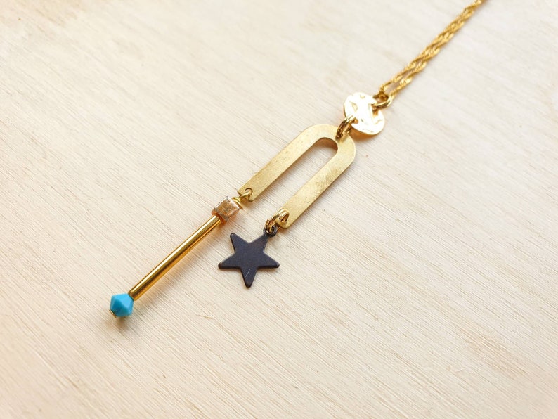 Star necklace with geometric elements on 18 gold plated chain with turquoise crystal bead accent Celestial Geometric necklace