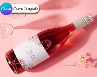 Op de afbeelding: Een fles roséwijn met een etiket met de tekst "Anelia's Bridal Shower July 21st 2024". Het etiket is versierd met bloemmotieven. De afbeelding bevat ook een wijnglas en de tekst "Canva Template".