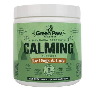 May include: A white plastic container with a green label featuring the text "Green Paw Wellness" and "Calming Support for Dogs & Cats." The label also includes the text "Maximum Strength," "Sedative Free," and "100 Capsules."