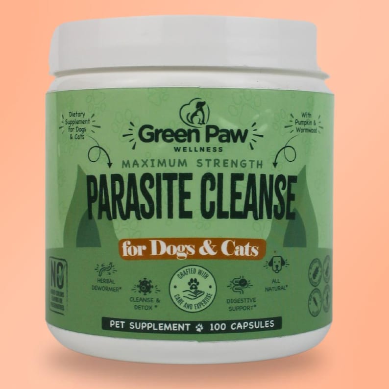 May include: Green Paw Wellness Maximum Strength Parasite Cleanse for Dogs & Cats, a green and white bottle with a label that says "Parasite Cleanse" and features a paw print logo. The bottle contains 100 capsules and is a dietary supplement for dogs and cats.