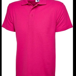 May include: A bright pink short-sleeved polo shirt with a button-up collar.
