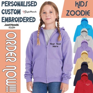 May include: A lavender zip-up hoodie with the text "Your Text Here" on the chest. The image also shows a variety of other colored hoodies, including blue, gray, purple, yellow, navy, and red. Text on the image reads "Personalised Custom Embroidered" and "Kids Zoodie".