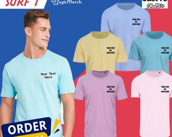 May include: A promotional image showcasing a variety of personalized, embroidered t-shirts in various colors, including light blue, yellow, teal, purple, and pink. Each shirt features the text "Your Text Here" and "Logo Here". The image also includes the text "ORDER NOW" and "SIZE XS - 2XL".