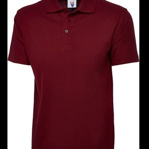 May include: A burgundy short-sleeved polo shirt with a button-up collar.