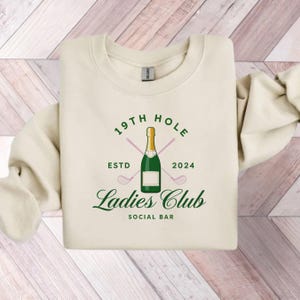 Felpa da golf da donna 19th hole club, eleganza oro e champagne
