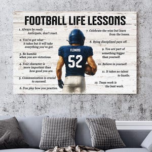May include: A wooden sign with the text "FOOTBALL LIFE LESSONS" and a football player illustration. The sign includes 12 life lessons, such as "Always be ready" and "Believe in yourself."