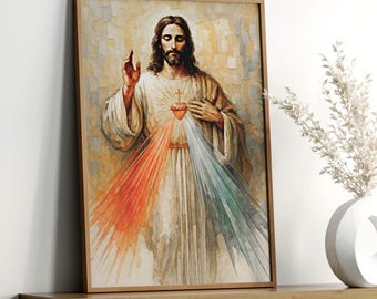 Könnte beinhalten: Ein gerahmter Druck einer religiösen Figur mit langen braunen Haaren und Bart, die ein weißes Gewand trägt. Die Figur hat ein rotes Herz mit einem Kreuz und Strahlen aus orangefarbenem, weißem und grünem Licht. Das Kunstwerk wird auf einem Holzregal ausgestellt.