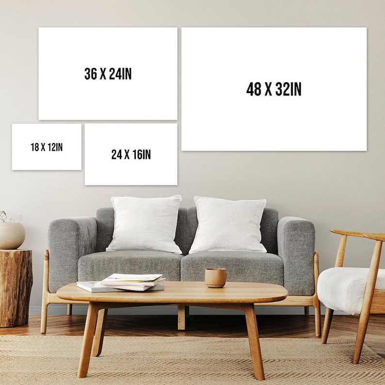 May include: A living room with a gray couch, a coffee table, and a chair. There are four white frames on the wall with the dimensions 18 x 12 in, 24 x 16 in, 36 x 24 in, and 48 x 32 in.