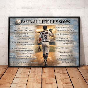 May include: A framed wall art print titled BASEBALL LIFE LESSONS featuring a baseball player in a white uniform with the number 8 on the back, holding a bat over their shoulder. The print includes a list of twelve numbered life lessons.