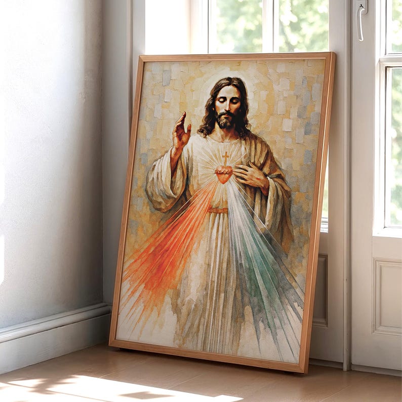 May include: A framed religious artwork depicting a figure with long hair and a beard, wearing a white robe. The artwork features a heart with a cross and rays of red, white, and green light emanating from the figure's chest. The frame is made of wood.