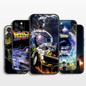 May include: A collection of five smartphone cases featuring Back to the Future movie imagery. The designs display the DeLorean time machine, lightning, fire, clock faces, and the film logo in vibrant colors against dark, cinematic backgrounds.