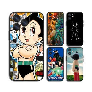 May include: Five black-framed smartphone cases featuring Astro Boy imagery. One large case shows a comic book collage with the character. Four smaller cases display various scenes, including a split-face cyborg design, a white silhouette, a group action shot, and a character standing in a field.