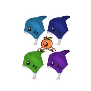 May include: Four shark hats in different colors: blue, green, purple, and teal. The hats have white teeth and eyes. The hats are on a white background. Apricot DIY Patterns is printed on a white ribbon.