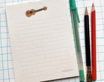 Lined Notepad Ukulele illustrations on speckled paper