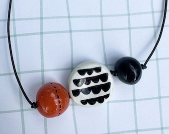 Large handmade Beaded Necklace orange black and white scallops by Robayre