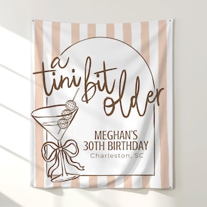 Custom martini-themed birthday banner with 'Tini Bit Older' wording, perfect for a cocktail party photo backdrop. This large sign is ideal for 30th or 40th birthday decor and sets the tone for a fun espresso martini celebration. Use it as a focal point for your Tini Bit Party or Dirty Martini event.