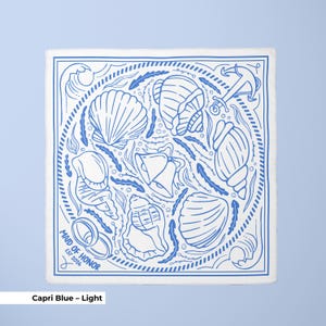 A monogrammed scarf created as a beach wedding favor with seashell themed artwork and subtle wedding elements, personalized for each bridesmaid or guest, suitable as a bridal shower favor or group discount gift, blending decorative appeal with wearable bachelorette party accessories.