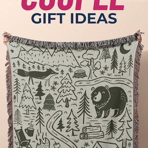 Cozy woven blanket for outdoor couples — a beautiful and practical gift for campers, hikers, and nature lovers. Perfect as an engagement gift, wedding gift, or anniversary surprise for an adventurous couple who loves glamping and cozy nights under the stars. The text overlay reads “Outdoor Couple Gift Ideas.” A thoughtful outdoor couple wedding gift, camping keepsake, or special glamping present for couples who love travel, campfires, and quality time in nature.