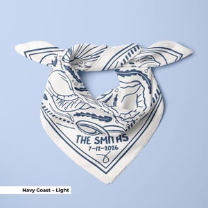 A navy blue customized wedding bandana designed for a seaside bridal party, featuring elegant seashell elements and subtle wedding-themed details, ideal as a bulk wedding favor or bridesmaid gift, doubling as a bridal neck tie or head scarf for coordinated event styling.