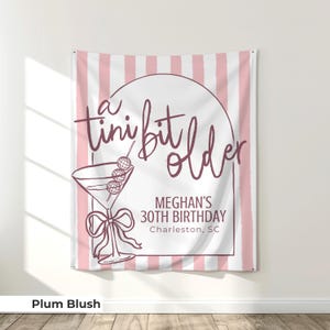 Large 'Tini Bit Older' birthday banner with martini glass graphics for cocktail-themed parties. A standout choice for 30th or 40th birthday decor, this espresso martini party sign brings glamour and humor to any martini-themed celebration.