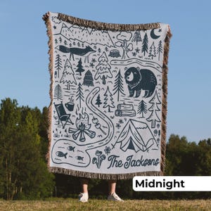 Adventure-themed personalized camp blanket, made from soft cotton with a rustic design that’s a thoughtful gift for national park lovers or van life travelers.