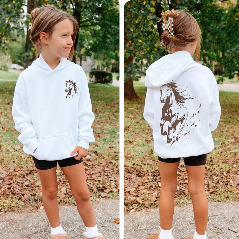 Tween girl modeling a youth equestrian hoodie with horse design, smiling and looking to the side.