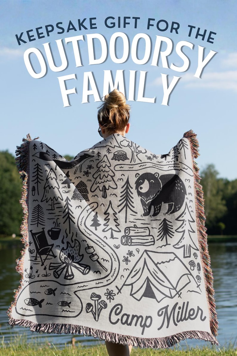 Keepsake Gift For the outdoorsy family and women wearing custom family name blanket with an outdoor design, ideal camping throw for couples, van life gift or camping trip family gift. This premium woven blanket is the perfect family blanket for outdoor lovers, ideal as a garden blanket, cozy cabin blanket, a travel blanket or forest themed home decor blanket