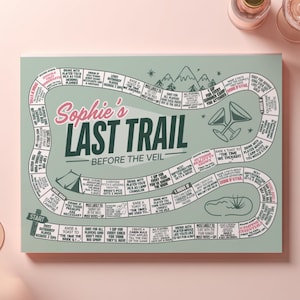 Camp Bride themed printable board game featuring an editable layout for a custom drinking game at a bridal weekend getaway. Perfect for a cabin hen party, outdoor bridal shower activity, or lake bachelorette bash, this customizable party game adds fun and laughter to the bride’s last trail before the veil.