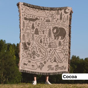 Man holding customized outdoor camping blanket in brown and woven cotton, unique outdoor gift for couple or an adventure family holiday gift