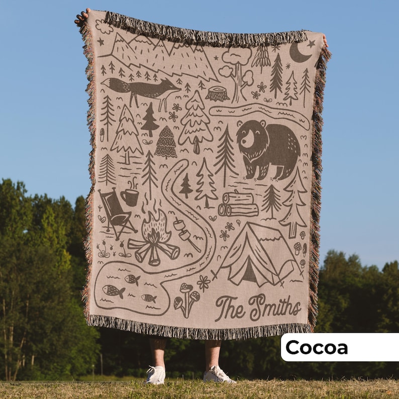 Man holding customized outdoor camping blanket in brown and woven cotton, unique outdoor gift for couple or an adventure family holiday gift