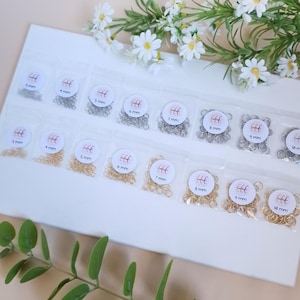 Rostfria hoppringar, guld och silver, olika diametrar - 40 stycken