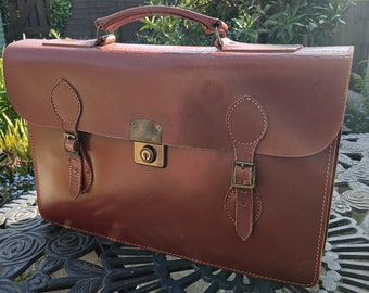 English made leather two pocket briefcase with key.